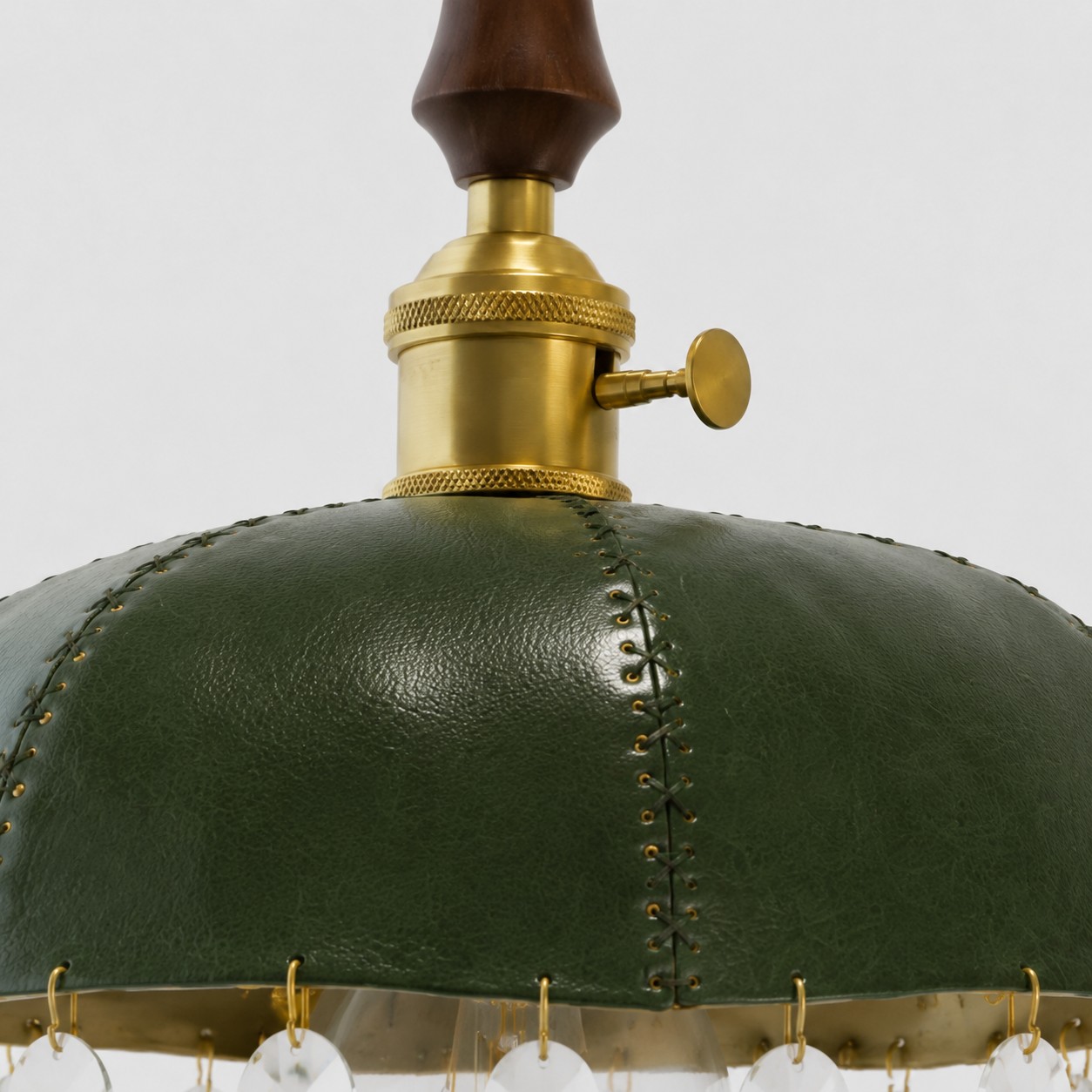 Deep green leather shade with metal fitting and stitched trim