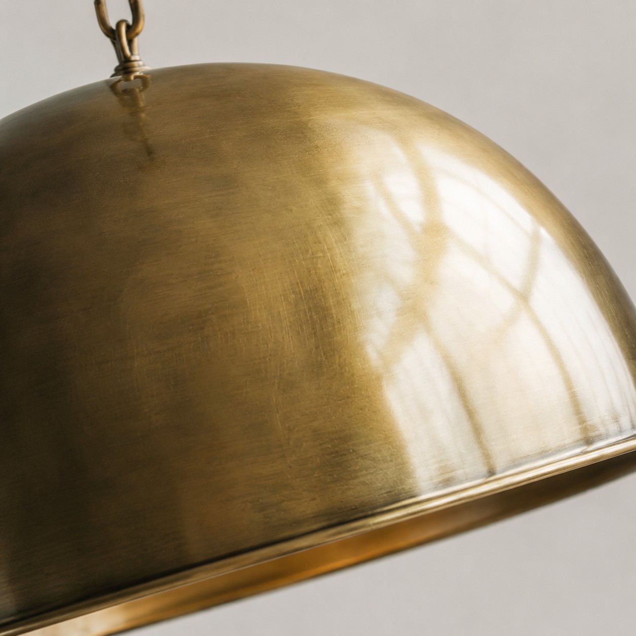 Close detail of the brushed antique brass dome surface