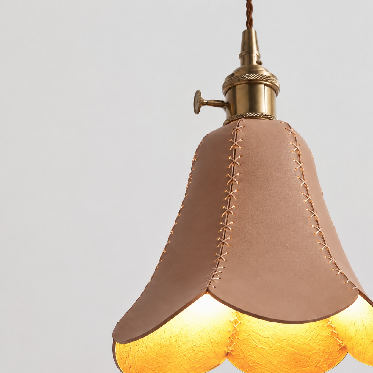 Hand-stitched leather shade seam